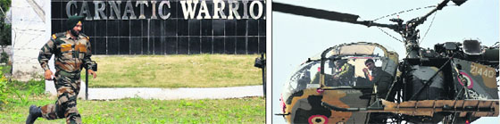 An Army jawan runs to take position during a fidayeen attack in the Samba area; and (right) an Army chopper keeps a vigil on the area in Jammu on Thursday