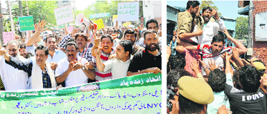 Government employees take out a protest march; and (right) the police detains protesters in Srinagar on Thursday. Tribune photos: Amin War