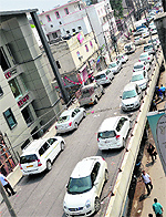 Vehicles parked on the incomplete Lakkar Bridge flyover in Ludhiana on Thursday