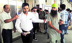 A Travelling Ticket Examiner stops a passenger to check his tickets at the Ludhiana railway station on Thursday