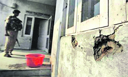 Bullet marks on the wall of the Hira Nagar police station after the militant attack.  PTI