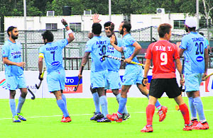The Indian mens team celebrates after scoring a goal against Korea at the Taman Daya Hockey stadium in Johor Bahru on Thursday. 