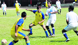 Players in action during the All-India PF Employees Football Tournament in Bathinda on Friday. Tribune photo