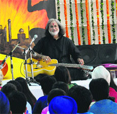 Pandit Vishwa Mohan Bhatt performs at Strawberry Fields World School on Friday. 