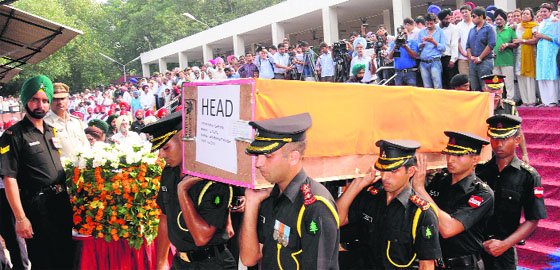 Defence personnel and residents pay their last respects to Lt Col Bikramjeet Singh, who died in a terrorist attack on an Army camp in Jammu