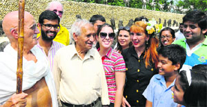 Delegates from different countries, along with local students, interact with Nek Chand, the creator of Rock Garden, in Chandigarh on Friday. 