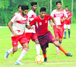 Players in action during a match at the Football Ground, Sector 42, in Chandigarh on Friday. 