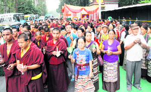 Tibetans take out a candlelight march in Dehradun on Friday.