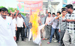 Hindu Jagran Manch activists burn an effigy of the Pakistan PM in Haridwar on Friday.