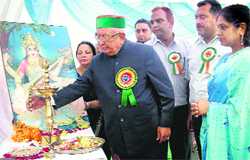 Assembly Speaker Brij Behari Lal lights a lamp during the inauguration ceremony of a science exhibition at Palampur on Friday. Photo: Ravinder Sood 