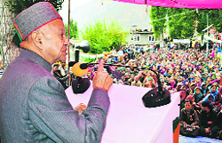 Chief Minister Virbhadra Singh addresses people at Udaipur in Lahaul-Spiti on Friday.