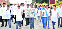 Students celebrate World Tourism Day by taking out an awareness walk on the global theme of Tourism and Water: Protecting Our Common Future at LPU near Jalandhar on Friday. Tribune Photo: Malkiat Singh