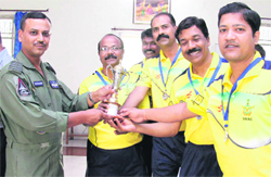 Players of Headquarters Training Command receive the winners trophy of the 10th Air Force Inter-command Civilian Carrom Tournament ins Adampur on Friday. A Tribune Photograph