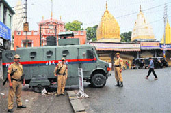 Security personnel keep vigil near Raghunath Temple during a bandh in Jammu on Friday against Thursdays twin militant attacks.