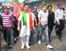 BJP activists take out a protest march against the twin terror strike in Reasi on Friday. 