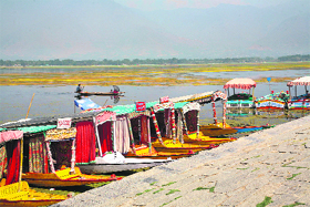 Boats moored on the bank of the Dal Lake in Srinagar on Friday.