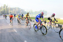 Participants in action during the fifth stage of the Khyber 12th Tour de Kashmir cycling expedition in Srinagar on Friday.