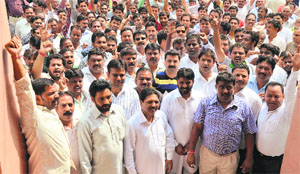 Valmiki leaders raise slogans against MC superintendent Rajiv Bharadwaj at the MC Zone A office in Ludhiana on Friday. 