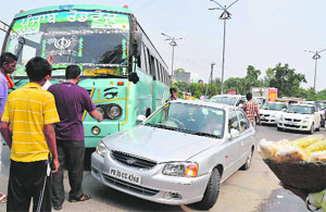 A bus and a car that collided on the Jalandhar bypass in Ludhiana. 