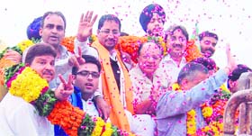 Supporters of the BJP welcome new Punjab Local Bodies Minister Anil Joshi on his arrival to Amritsar on Saturday.