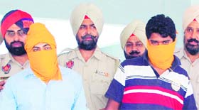 Sukhjinder Singh and Jiwan Singh in police net in Amritsar on Saturday.