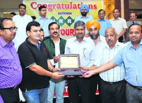 Members of the Bathinda Hotel, Restaurant and Resorts Association present a memento to Chief Parliamentary Secretary Sarup Chand Singla during the World Tourism Day celebrations in Bathinda on Saturday.