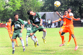 Players struggle to take control of the ball at the ongoing All-India Administrators Challenge Football Cup in Chandigarh on Saturday. 