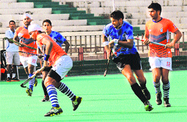 Players in action at the SN Vohra Hockey Tournament held at Hockey Stadium, Sector 42, Chandigarh. 