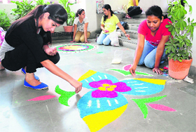 Students take part in a rangoli competition on World Tourism Day at the Chandigarh Institute of Hotel Management, Sector 42, in Chandigarh on Saturday. 