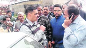 The leaders of the protesting faction of the MC employess speak to an MC offcial (right) in Mussoorie on Saturday.