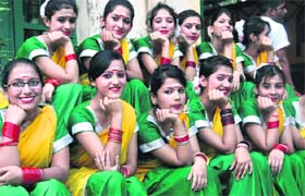 Schoolgirls wait for their turn to perform at a function held at St Thomas College in Dehradun on Saturday.