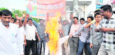 Hindu Jagran Manch activists burn an effigy of the Pakistan PM in Haridwar on Friday.