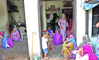 Dharmender s family and relatives grieve over his death at Garnawati village of Rohtak district.