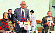 Governor NN Vohra releases a souvenir at a seminar in Srinagar on Saturday
