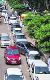 Haphazardly parked vehicles in the absence of designated parking lots in Jammu.
