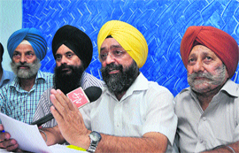 A member of the Sikh United Front J&K addresses a press conference in Jammu on Saturday.