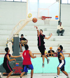 A cager tries an alley-oop during a match at Guru Nanak Stadium, Ludhiana, on Saturday.