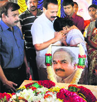 A BJP leader consoles Nagamani, elder sister of Sudarshan who was killed in the Nairobi attack, at their home in Bengaluru on Saturday. 