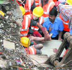Rescue work in progress  in Mumbai on Saturday. 