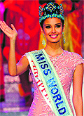 New Miss World, Megan Young, from the Philippines waves after winning the crown in Bali on Saturday