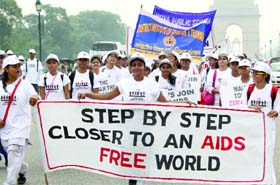 Students participate in a walk for Life, to create awareness about HIV/AIDS at India Gate in New Delhi on Sunday.