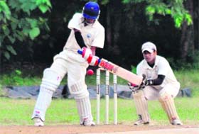 A batsman plays a shot during the HNB Garhwal University Inter-Collegiate Twenty20 Cricket Tournament in Dehradun on Sunday