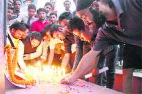 Remembering martyr: Younths light candles to pay tributes to Shaheed Bhagat Singh at Clock Tower in Dehradun on Saturday