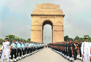 Inter-Services personnel march near Amar Jawan Jyoti at India Gate during a ceremony to pay homage to Kargil war martyrs on the occasion of 