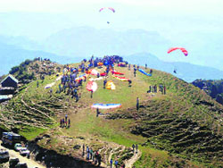 Paragliders making preparations to fly at Bir Billing in Kangra.