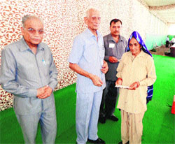 Commander Inder Singh (Vir Chakra ), president, Haryana Ex-Servicemen League (HESL), honours a war widow in Kaithal on Sunday. As many as 12 war widows were honoured and presented mementoes and monetary help.