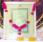 A photograph of Pt Shardha Ram Phillauri; and (right) Neelam, a devotee, at a temple located at Passia Chowk in Phillaur. 
