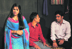 A scene from the Dogri play Geya Gai Kuthe Haa, staged at Natrang Theatre in Jammu on Sunday.