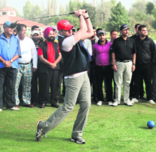 Chief Minister Omar Abdullah takes a shot after teeing-off the golf tournament in Srinagar on Sunday. 