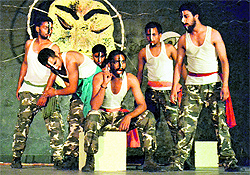 Artistes enact a scene from the play "Nitya Nithur Duwand" at the Punjabi Bhawan in Ludhiana